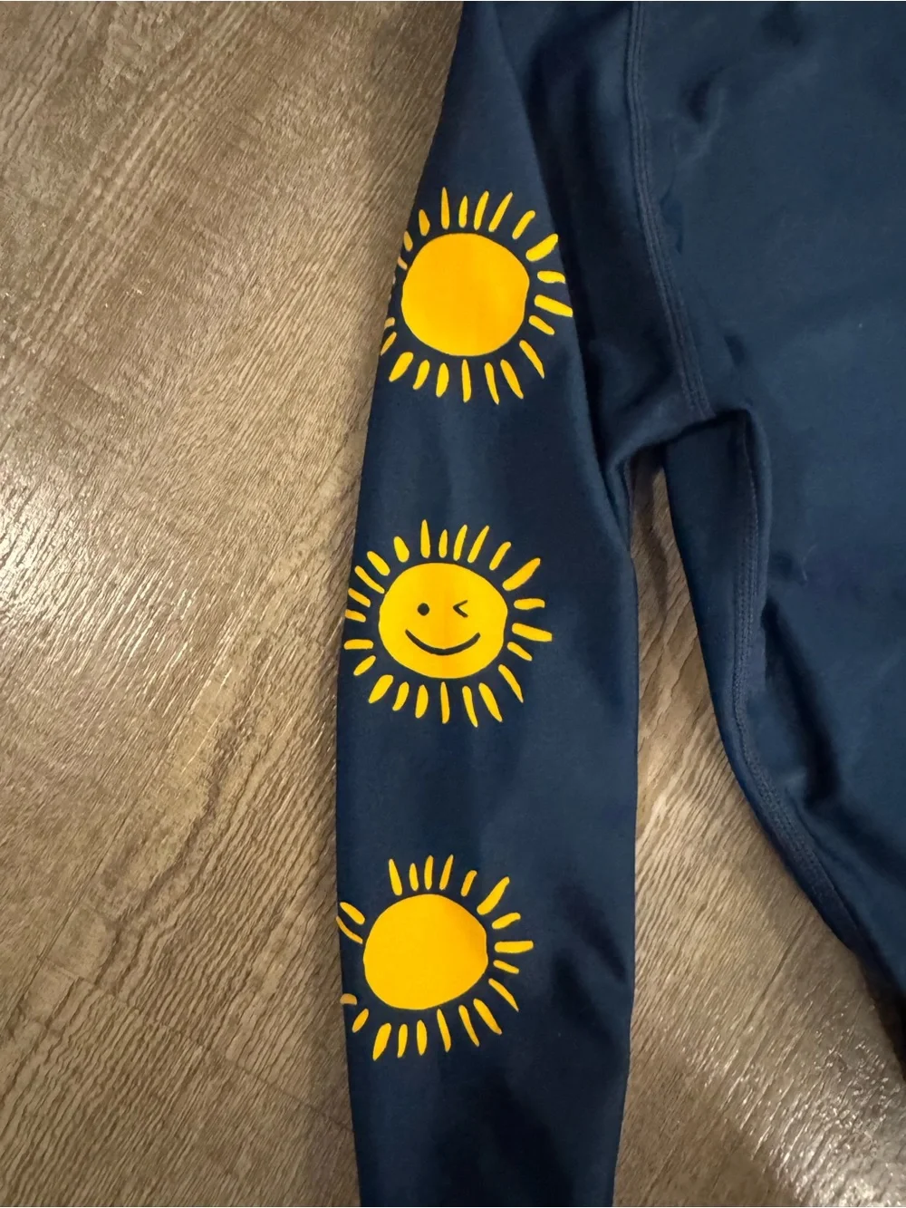 Tea Collection Navy Sun Sleeve Rash guard  - Yellow Suns on arms. Like new.